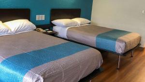 Ένα ή περισσότερα κρεβάτια σε δωμάτιο στο Motel 6-Daytona Beach, FL - Speedway +23 φωτογραφίες