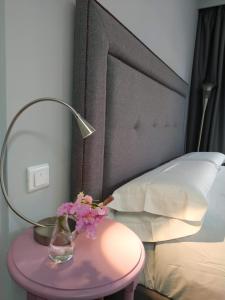 Postel nebo postele na pokoji v ubytování Kentia Rooms
