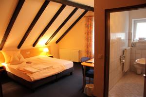 Postel nebo postele na pokoji v ubytování Hotel Klinger