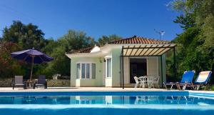 a small house with a pool in front of it at Villa Sikia in Katokhórion