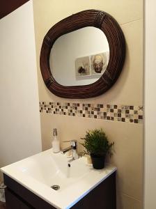 a bathroom with a sink and a mirror at Casa da Lameira in Serra