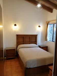 Postel nebo postele na pokoji v ubytování Villas Tequisquipan