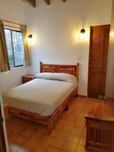 Postel nebo postele na pokoji v ubytování Villas Tequisquipan