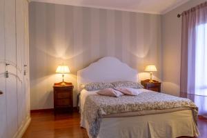 Posteľ alebo postele v izbe v ubytovaní Lillà - Home and Garden