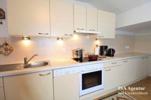 Kuchyň nebo kuchyňský kout v ubytování Family Apartment ENZIAN Top 9