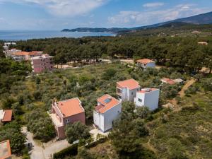 an aerial view of a house with the ocean in the background at Studios Koula 2 - KORINA in Potos