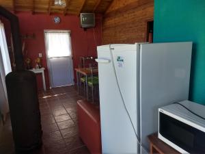 Η κουζίνα ή μικρή κουζίνα στο complejo el paraiso 2