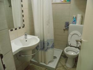 a small bathroom with a sink and a toilet at Apartman Šego in Vela Luka +23 photos