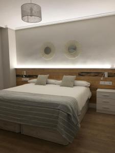 A bed or beds in a room at Apartamento Abuelo Mayorga