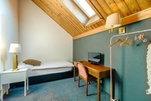 Voodi või voodid majutusasutuse Hôtel la Croix Blanche toas +37 fotot