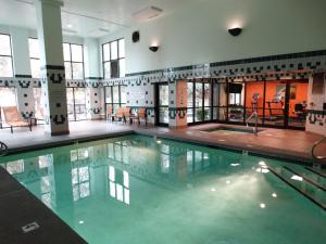 a large swimming pool in a building at Best Western Plus Provo University Inn in Provo