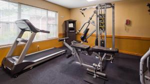 a gym with two tread machines in a room at Best Western West Greenwich Inn in West Greenwich