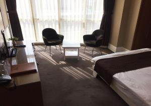 A bed or beds in a room at City Hotel Plovdiv