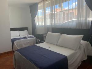 Postel nebo postele na pokoji v ubytování Hotel Casa Guillermo + 37 fotografií