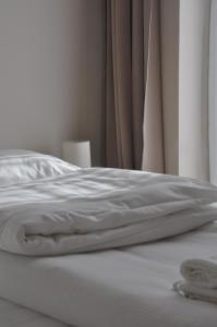 Cama ou camas em um quarto em Centrál Vendégház Székesfehérvár