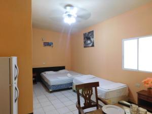 Cama o camas de una habitación en La Fortaleza Granada Resort
