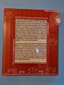 a page of a book with a snowflake on it at Siedlisko Zakucie in Jaśliska