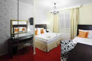 Postel nebo postele na pokoji v ubytování Pytloun Design Self Check-in Hotel