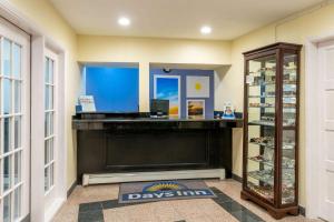 a room with a large fireplace in a store at Days Inn by Wyndham Grants in Grants