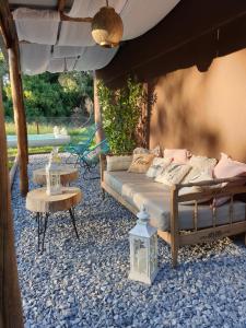 a bedroom with a bed and a table at Cabañas Chic Cumbre in Sierra de los Padres
