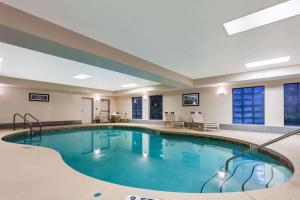 a large swimming pool in a hotel room at La Quinta by Wyndham Port Orange / Daytona in Port Orange