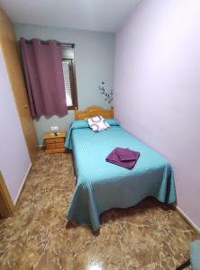 A bed or beds in a room at Hostal El Bodegon