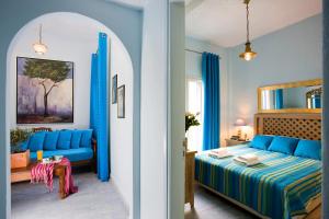 A bed or beds in a room at Alesahne Beach Hotel