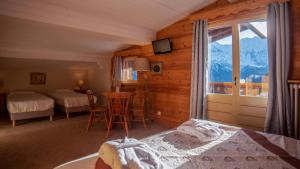 Postel nebo postele na pokoji v ubytování Hôtel Arbois Bettex