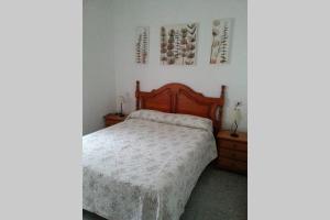 A bed or beds in a room at Casa a pie de playa en Las Marinas