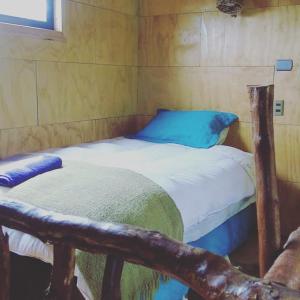 Postel nebo postele na pokoji v ubytování La Ranchita de Queilen