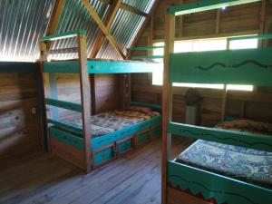 Μία ή περισσότερες κουκέτες σε δωμάτιο στο Ch'i Bocól Community Hostel