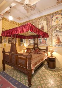 Postel nebo postele na pokoji v ubytování Hotel Bissau Palace