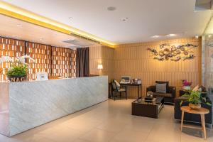 a lobby of a hotel with a reception desk at Naga Residence in Bangkok