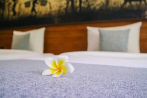 Postel nebo postele na pokoji v ubytování De Rekun Ubud