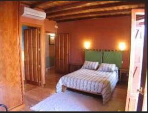 Cama o camas de una habitación en Casa Rural El Taller De Benito