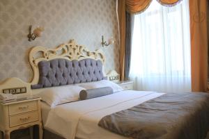 Un pat sau paturi într-o cameră la Nayla Palace Hotel-Special Category