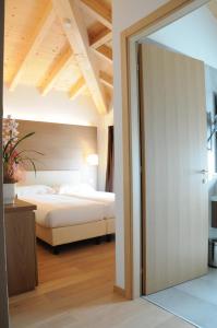 Postel nebo postele na pokoji v ubytování Hotel Operà