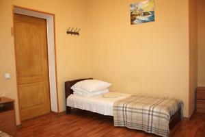 Postel nebo postele na pokoji v ubytování Inn Khlibodarskiy