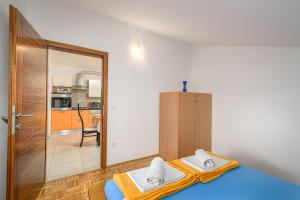 Postel nebo postele na pokoji v ubytování Music House Novalja