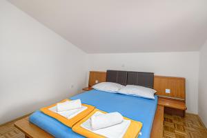 Postel nebo postele na pokoji v ubytování Music House Novalja