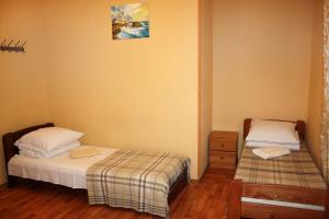 Postel nebo postele na pokoji v ubytování Inn Khlibodarskiy