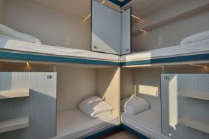 Letto o letti in una camera di Atlas Hostel & Backpackers
