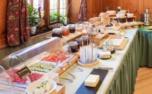a buffet line with cheese and other food on it at Nagelschmiede in Münsingen