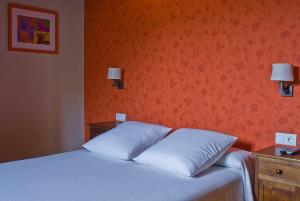 Postel nebo postele na pokoji v ubytování Posada Ruilobuca