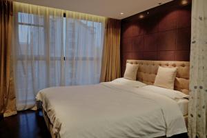 Tempat tidur dalam kamar di Ring Service Apartment 798 Art Zone