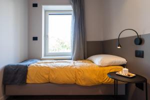 Voodi või voodid majutusasutuse Comfort Zone toas