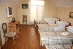 Postel nebo postele na pokoji v ubytování Inn Khlibodarskiy