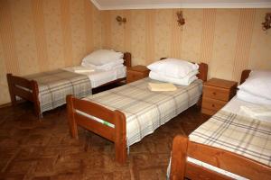 Postel nebo postele na pokoji v ubytování Inn Khlibodarskiy