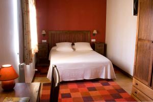 Een bed of bedden in een kamer bij Posada Ruilobuca