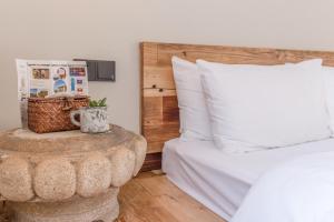 a bedroom with a bed and a wooden headboard at Zen Tea House Seven Stars Park in Guilin